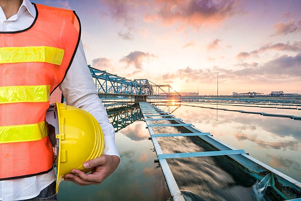 Engineer with The Solid Contact Clarifier Tank with sunrise stock photo