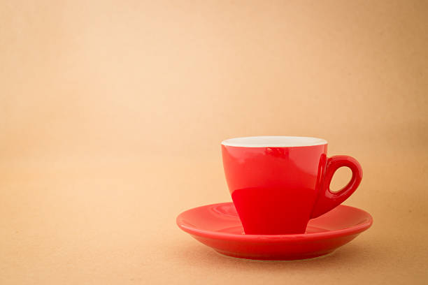 istock Beautiful red cup of coffee on vintage background 505212380