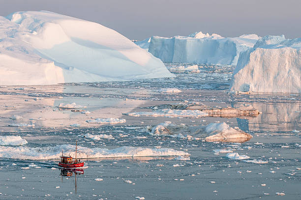 Boat among iceberg in Greenland Small boat, Icebergs, Ilulissat, Greenland disko bay stock pictures, royalty-free photos & images
