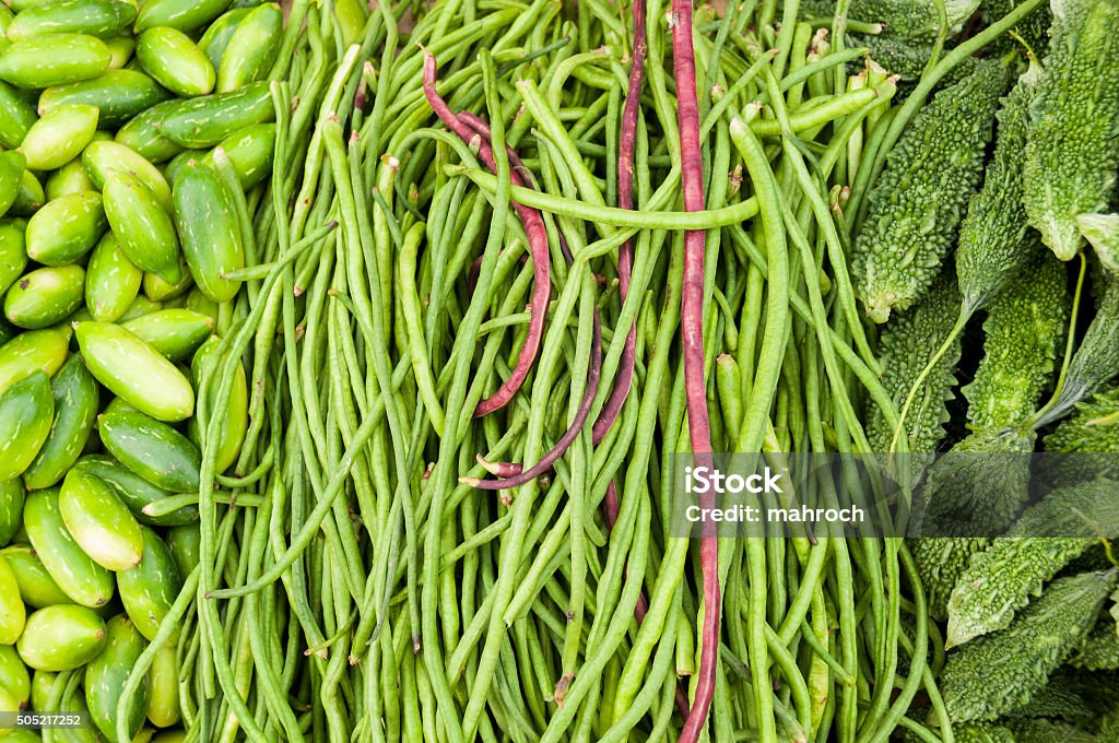 Bitter melon, cucumbers and longbeans at the market Bitter melon, cucumbers and longbeans at the indian market Agriculture Stock Photo