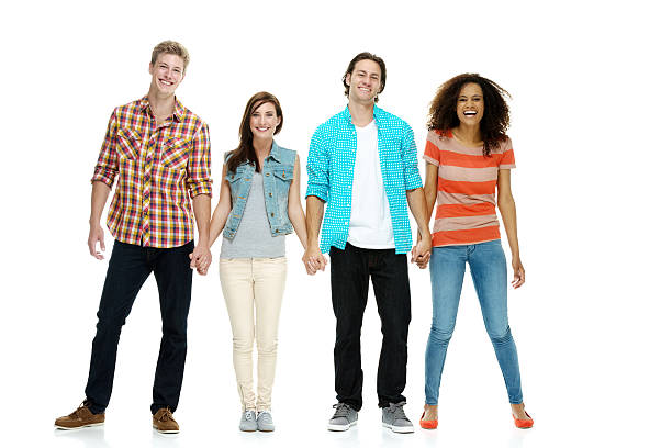 istock Smiling four friends standing and looking at camera 505217510