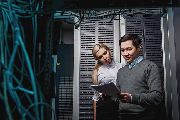 istock Young engineers businessmen in server room 505217714