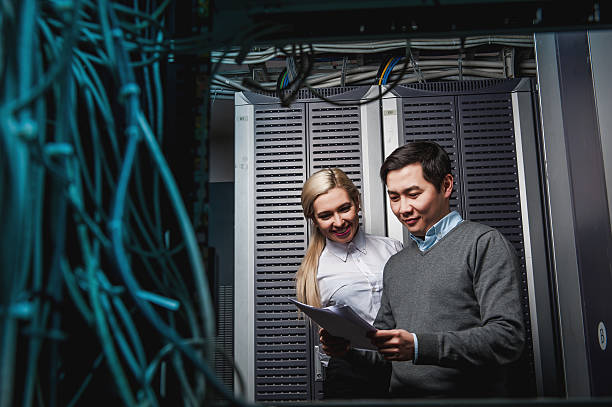 istock Young engineers businessmen in server room 505217746