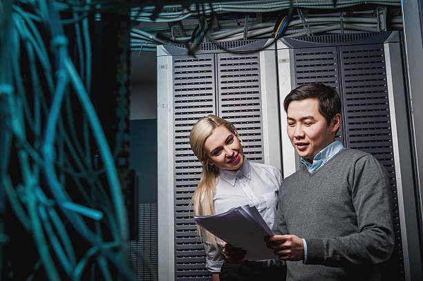 istock Young engineers businessmen in server room 505217848