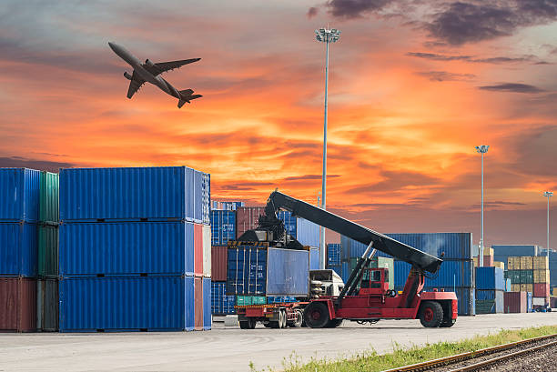 istock forklift handling the container box in logistic zone with sunset 505218132