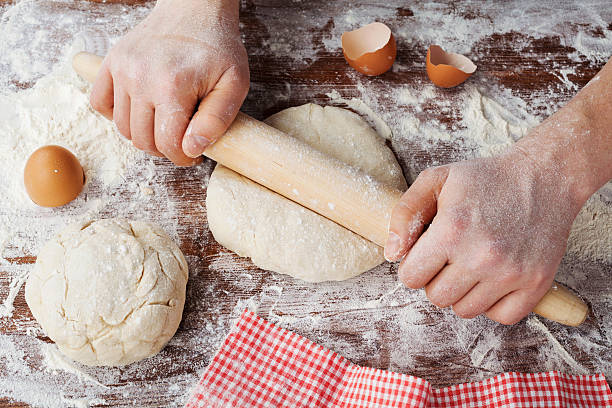 istock Male hands knead the dough with flour for bread, pizza 505218550