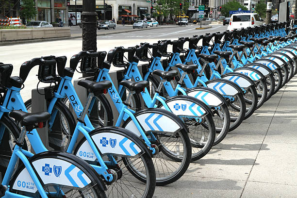 Divvy bike rental station in downtown Chicago Chicago, IL, USA - MAY 23, 2014: Available bikes for rent at the Divvy station in downtown Chicago. Divvy is one of the largest bike sharing systems in the United States.  fool stock pictures, royalty-free photos & images
