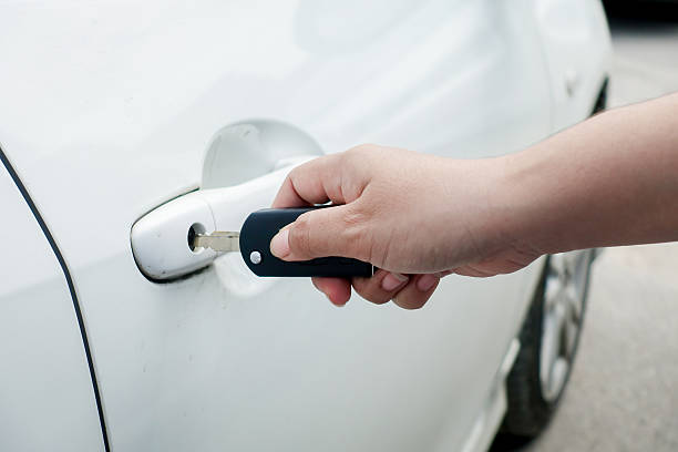istock woman hand holding car keys 505220034