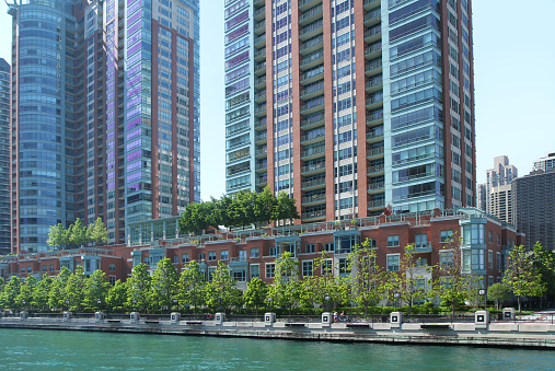 Photo taken from the Chicago River, view of Chicago Riverwalk and tall Condominiums