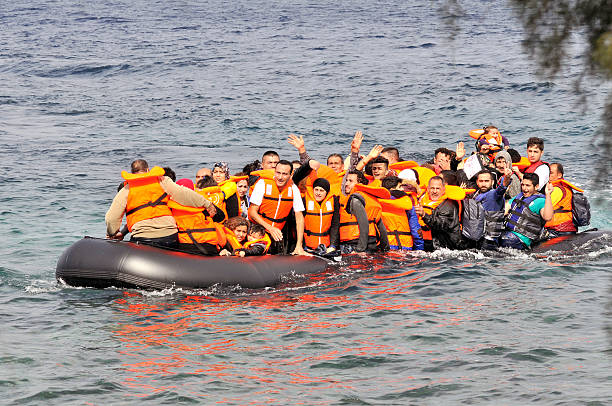 Refugees arrive at Greek island Lesvos stock photo