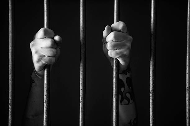 Hands holding the bars stock photo