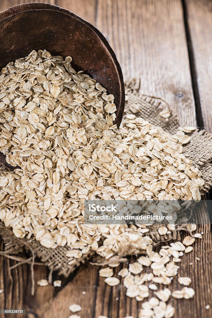 Portion of Oatmeal Portion of Oatmeal on dark wooden background (close-up shot) Bowl Stock Photo