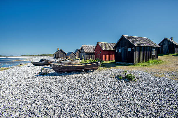 Old fishing village in the Baltic sea Helgumannens fishing village on Faro island in the Baltic sea rowing boat fishing stock pictures, royalty-free photos & images
