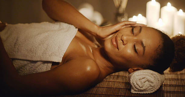 istock Woman Lying On Massage Table And Touching Her Face 505230862
