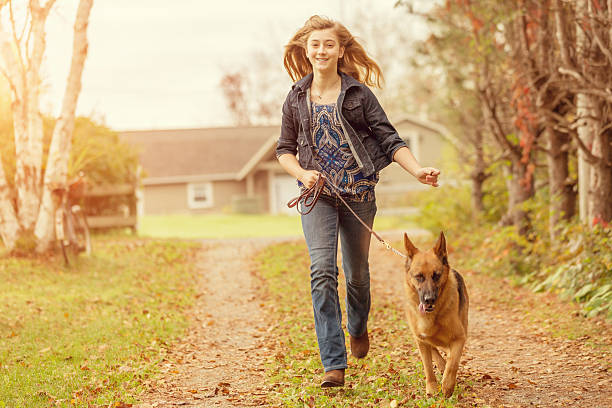 istock Girl with Dog, Autumn Fun 505231153