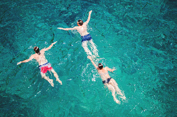 istock people swimming on the sea 505232267