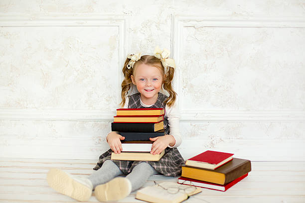istock little the girl with books 505232640