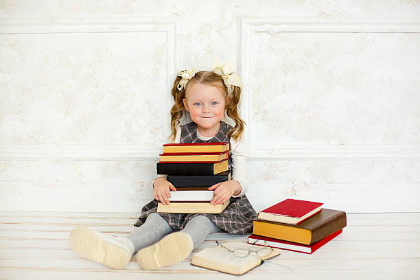 istock little the girl with books 505232980