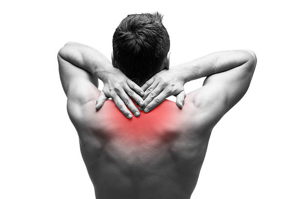 Pain in the neck isolated on white background Pain in the neck. Man with backache. Muscular male body. Isolated on white background. Black and white photo with red dot cervical vertebrae photos stock pictures, royalty-free photos & images