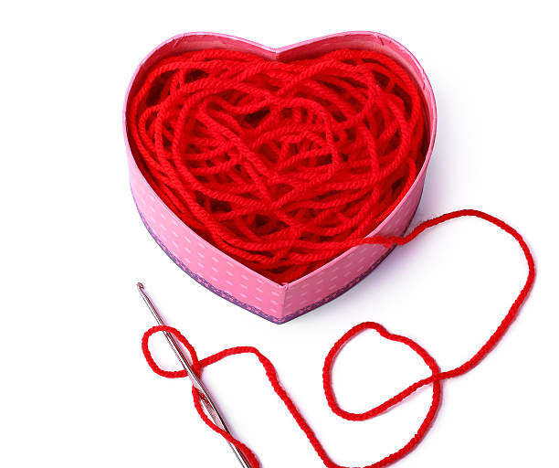 istock Heart-shaped box with a crochet and red needle 505233677