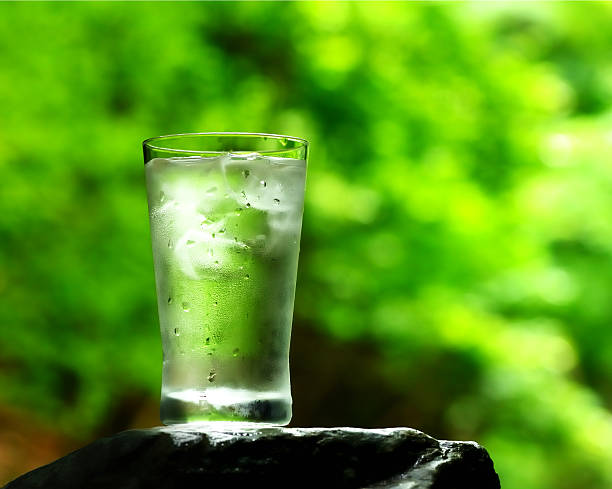 istock glass of water on nature background. 505233707