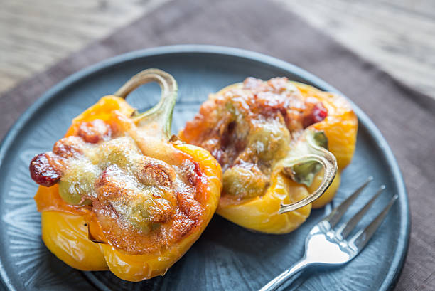 istock Stuffed peppers with sausages and mozzarella topping 505234392