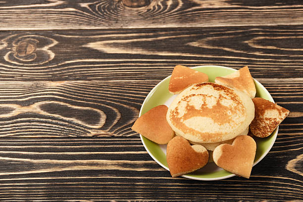 istock heart-shaped pancakes on wooden table 505234630