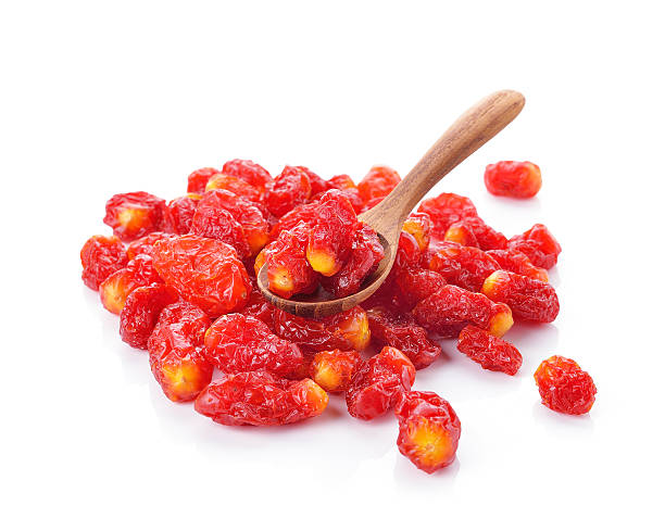 istock Wooden spoon with dried tomato on white background 505234982