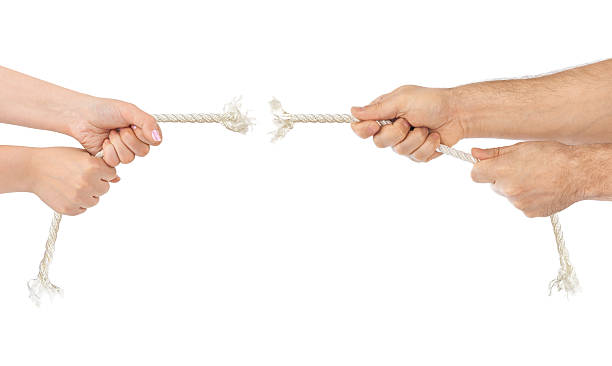 istock Man and woman hands with breaking rope 505235480