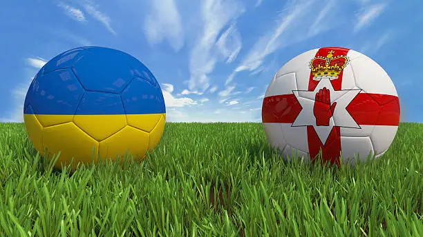 3D soccer balls with Ukraine and Northern Ireland flag, Euro 2016. Placed on 3d grass. Background isolated with clipping path.