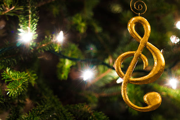 istock Gold Treble Clef Ornament with Christmas Tree 505236396