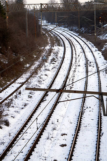 istock Railroad track and electrical traction during the winter 505236528