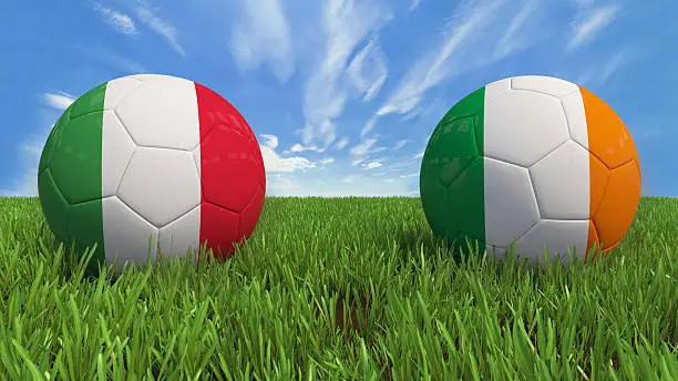 3D soccer balls with Italy and Republic of Ireland flag, Euro 2016. Placed on 3d grass. Background isolated with clipping path.