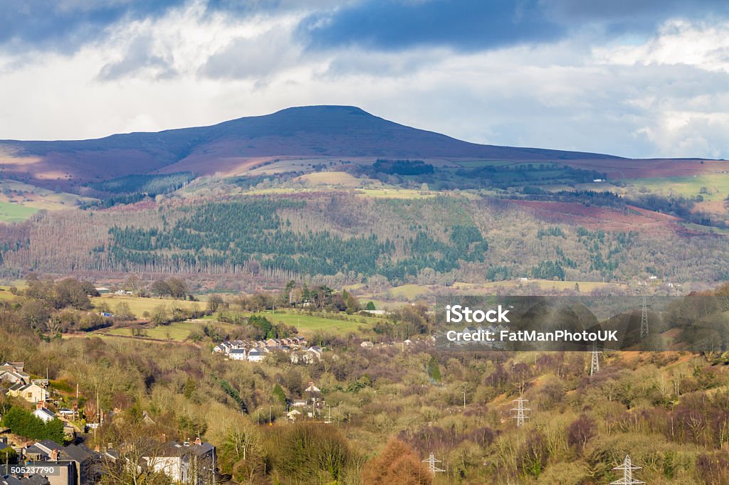 South Wales view towards the Sugar Loaf hill. Monmouthshire. View across the Heads of the Valleys Road, near Abergavenny towards the Sugar Loaf or Mynydd Pen-y-Fal, a hill or mountain in Monmouthshire, Wales, United Kingdom. Capital Cities Stock Photo