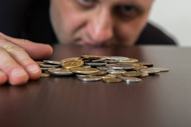 istock Numismatists examines  collection of coin 505238058