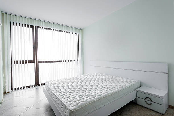istock New white bedroom with double bed 505238764