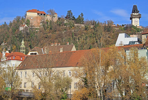 istock clock tower and some other buildings in Graz 505241226
