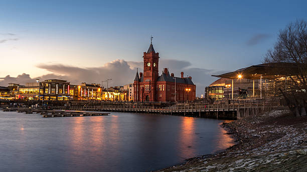 Pierhead Building at Cardiff Bay in Cardiff, UK (Twilight Shot) Pierhead Building, a Grade One listed building of the National Assembly for Wales in Cardiff Bay, Wales. A Cardiff's landmark taken from Cardiff Bay. cardiff wales stock pictures, royalty-free photos & images