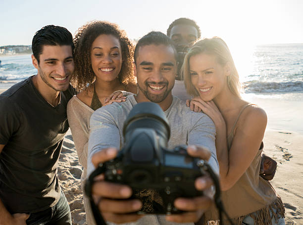 istock Friends at the beach taking a selfie 505244004