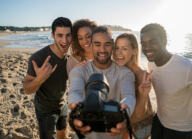 istock Young people taking a selfie at the beach 505244222