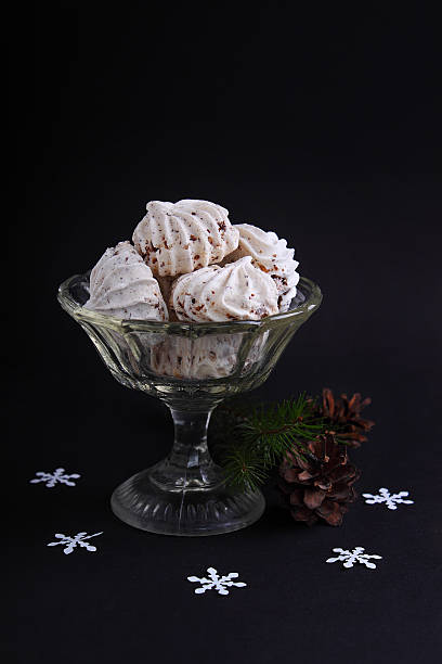 istock meringue cake on a black background 505246058