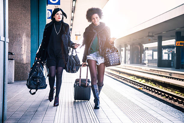 istock Friends at train station platform, tourist and commuters arriving 505246216
