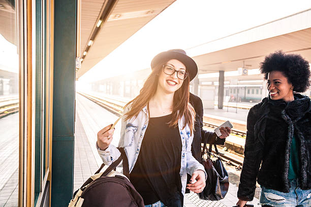 istock Friends at train station platform, tourist and commuters arriving 505246540