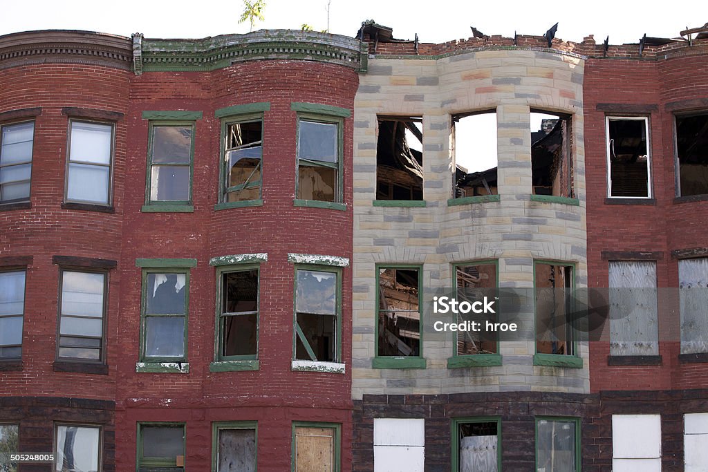 Abandoned row houses Abandoned areas in the city of Baltimore, many houses are vacant, damaged and become ruins. Baltimore - Maryland Stock Photo