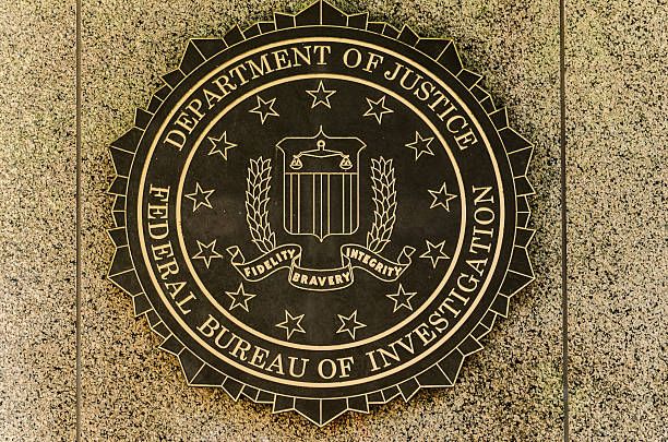 FBI emblem Washington, USA - April 24, 2011: FBI emblem on the J. Edgar Hoover F.B.I. Building in downtown Washington, DC fbi photos stock pictures, royalty-free photos & images