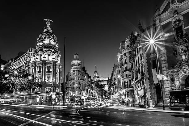 Gran Via in Madrid, Spain, Europe. Rays of traffic lights on Gran via street, main shopping street in Madrid at night. Spain, Europe. madrid city view stock pictures, royalty-free photos & images