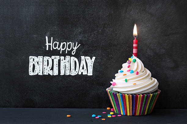 Birthday cupcake Birthday cupcake in front of a chalkboard cupcake candle stock pictures, royalty-free photos & images