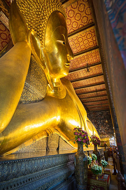 istock Reclining Buddha gold statue face in Wat Pho 505258974