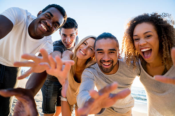 istock Fun group of friends at the beach 505259284