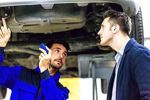 istock Auto Mechanic Talking With Car Owner 505259498